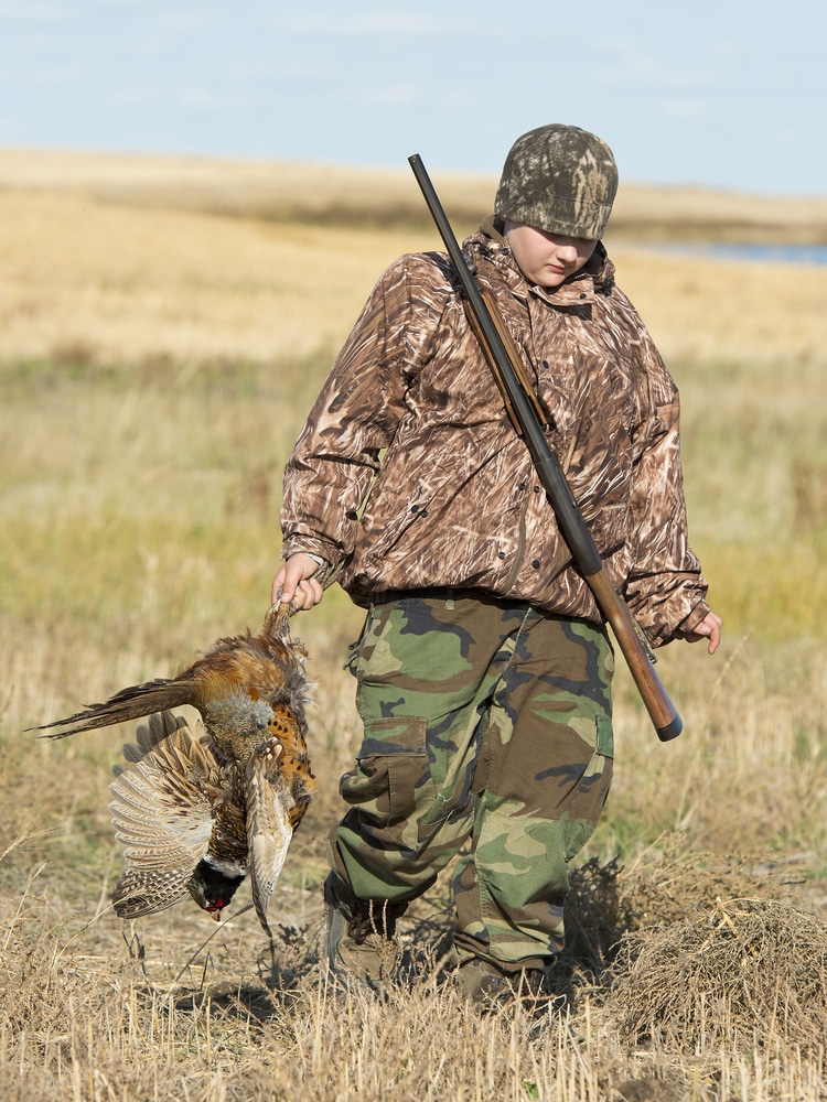 Young Boy Out Hunting In The Fall