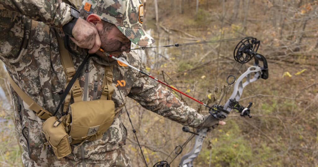 A view of a person aiming their shot from a tree stand