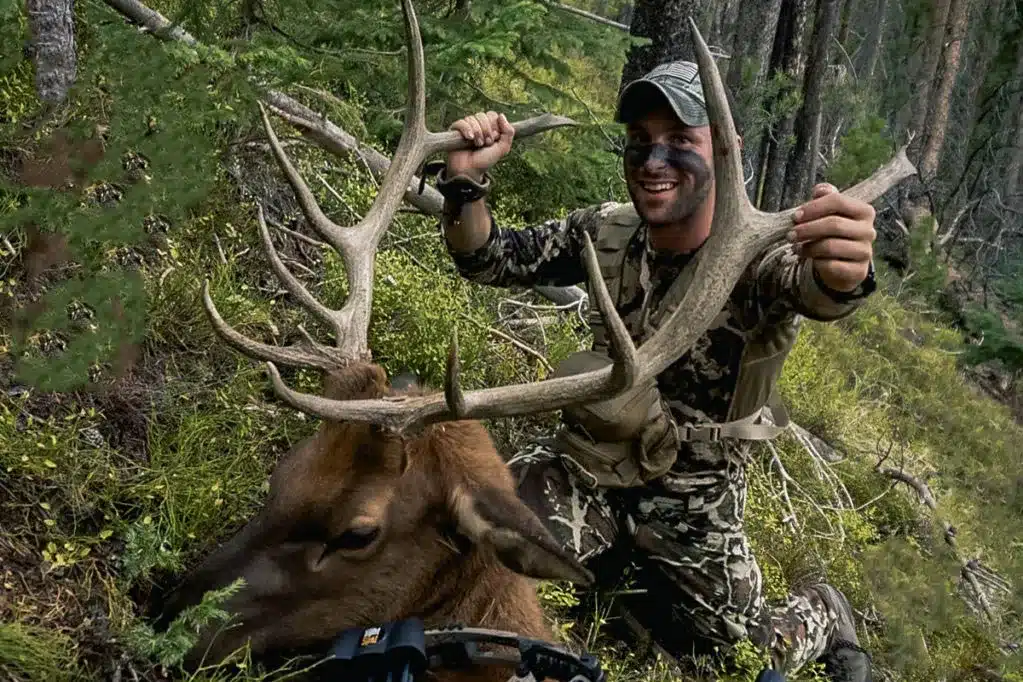 a man with his hunted elk