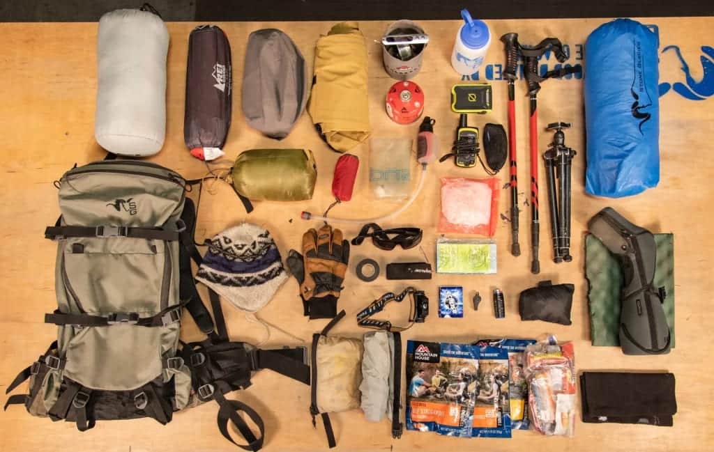 hunting gear essentials with plenty of items such as a backpack gloves hunting equipment pouches water bottle etc