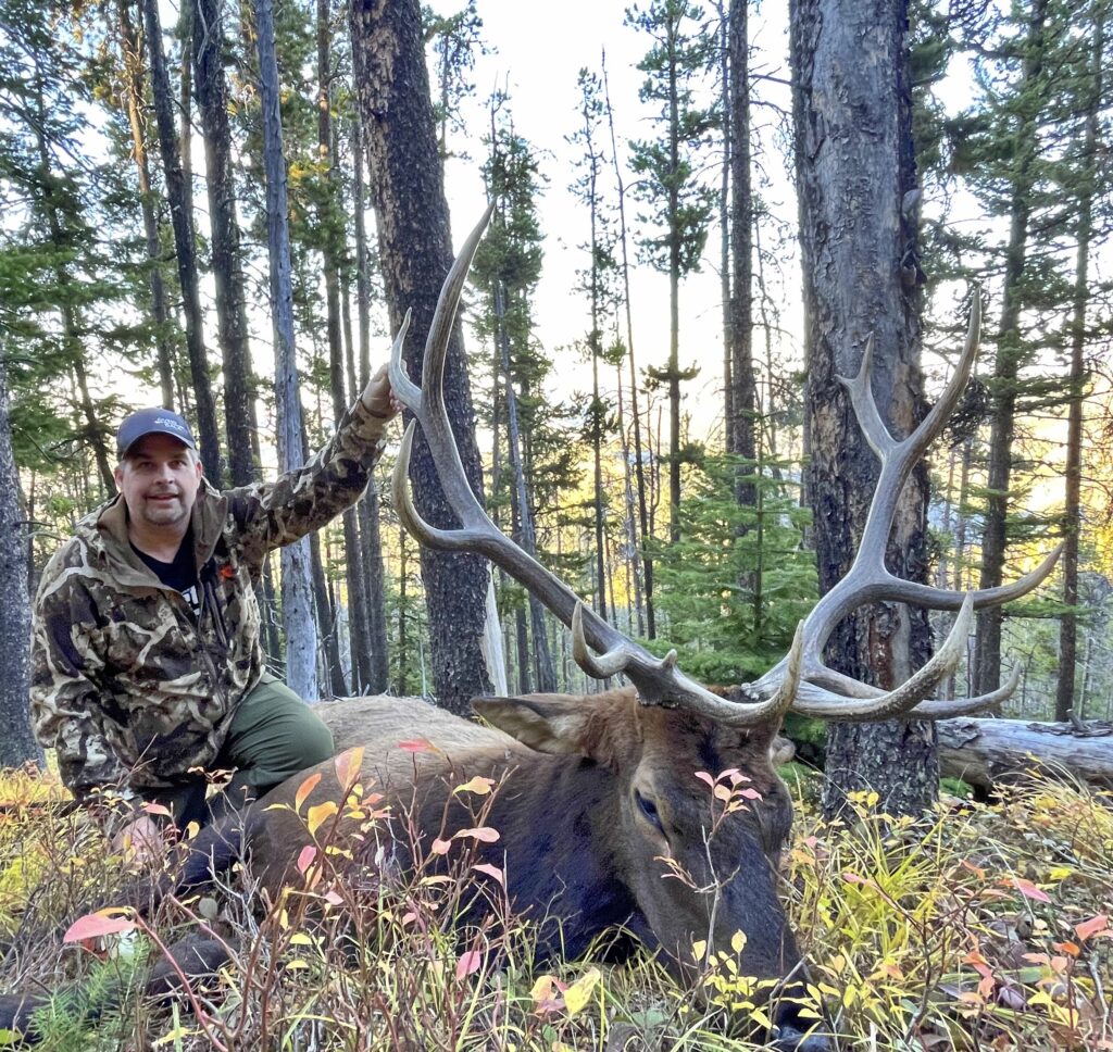 man with his hunted elk