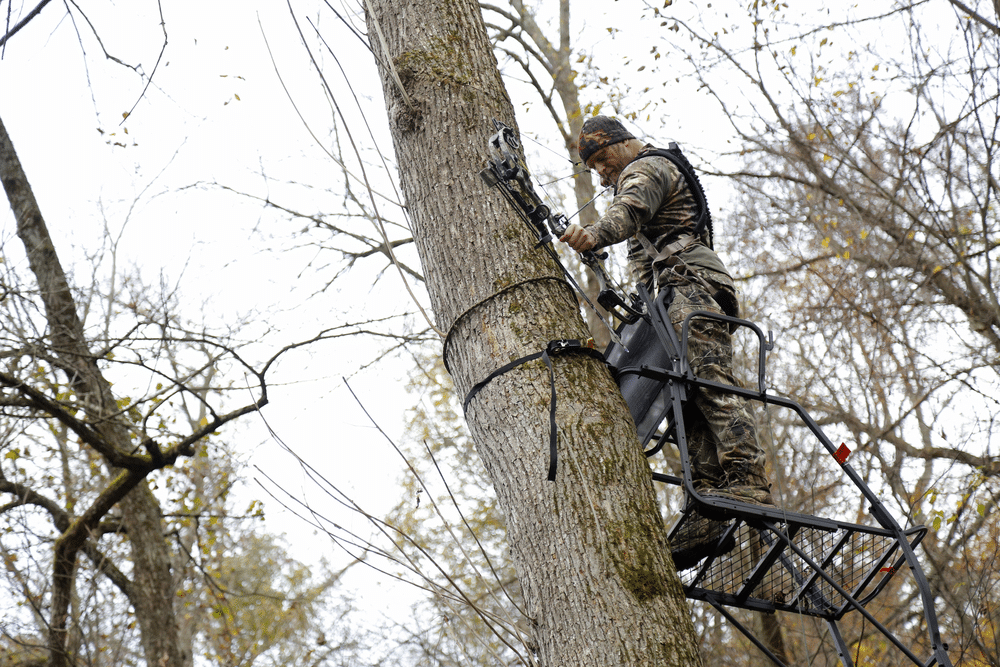 Bow hunter tree stand ladder climb