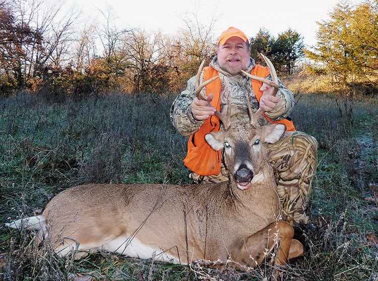 a hunter along with the hunted deer