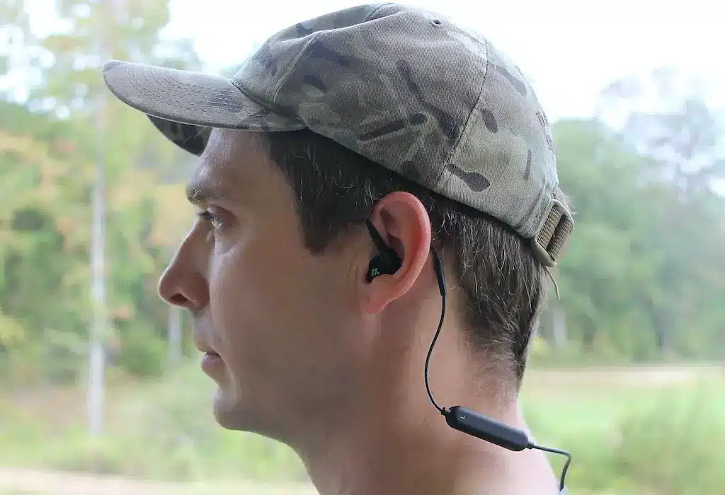 a man weaering GS Extreme Bluetooth Earbuds