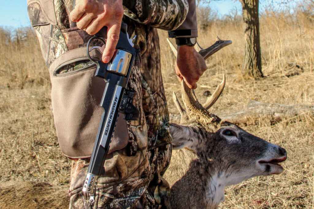 a hunted deer alongwith the gun