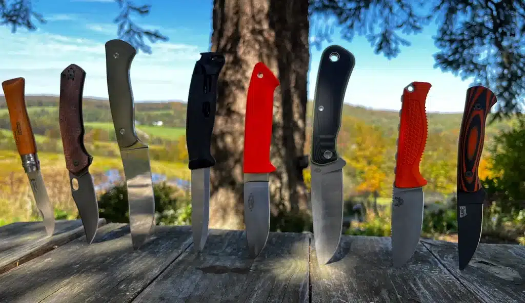 hunting knives stuck in a wodden table