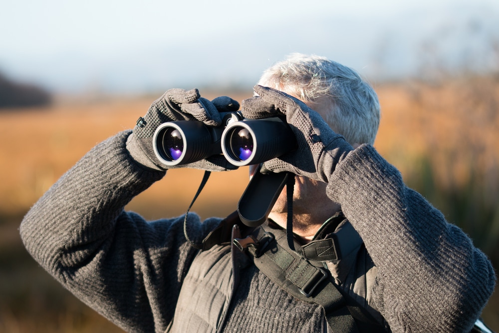 Gray Haired Man With Binocular