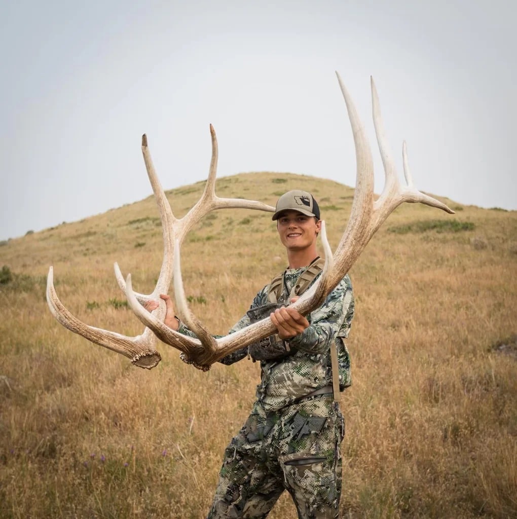 a person holding the sheded horns