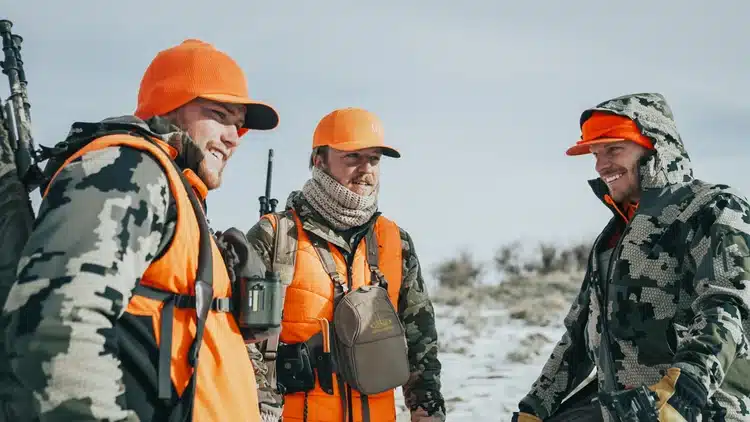 hunters smiling and wearing the winter gears for hunting in snow