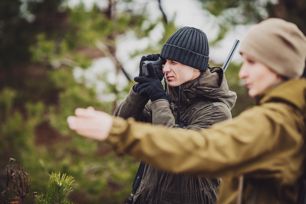 Male And Woman Hunters Ready To Hunt Holding Gun And